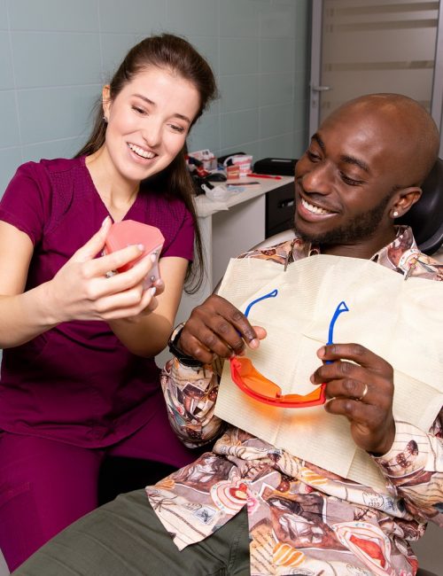 Doctor treats patient teeth in modern dental clinic. High quality photo